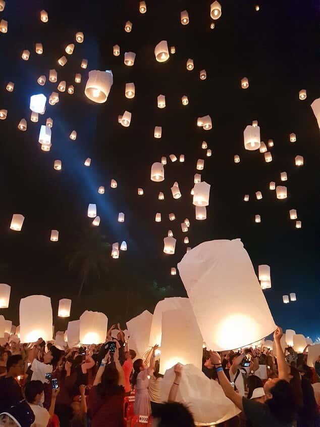 Lighting up lanterns at Yee Peng Festival